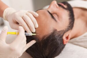 Man having PRP hair restoration